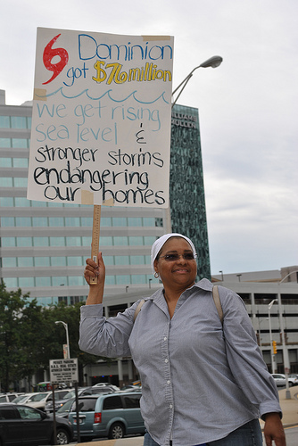 DeLevay Miner holds her picket sign at Dominion